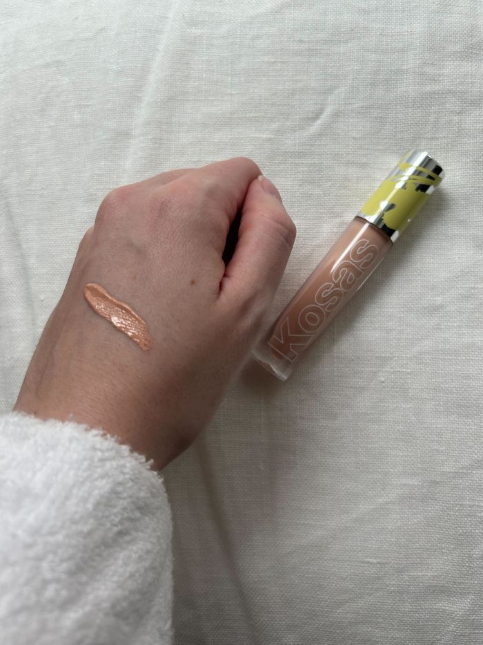 Junior beauty editor Grace Lindsay swatching the Kosas Revealer Extra Bright Serum Powered Color Corrector Review