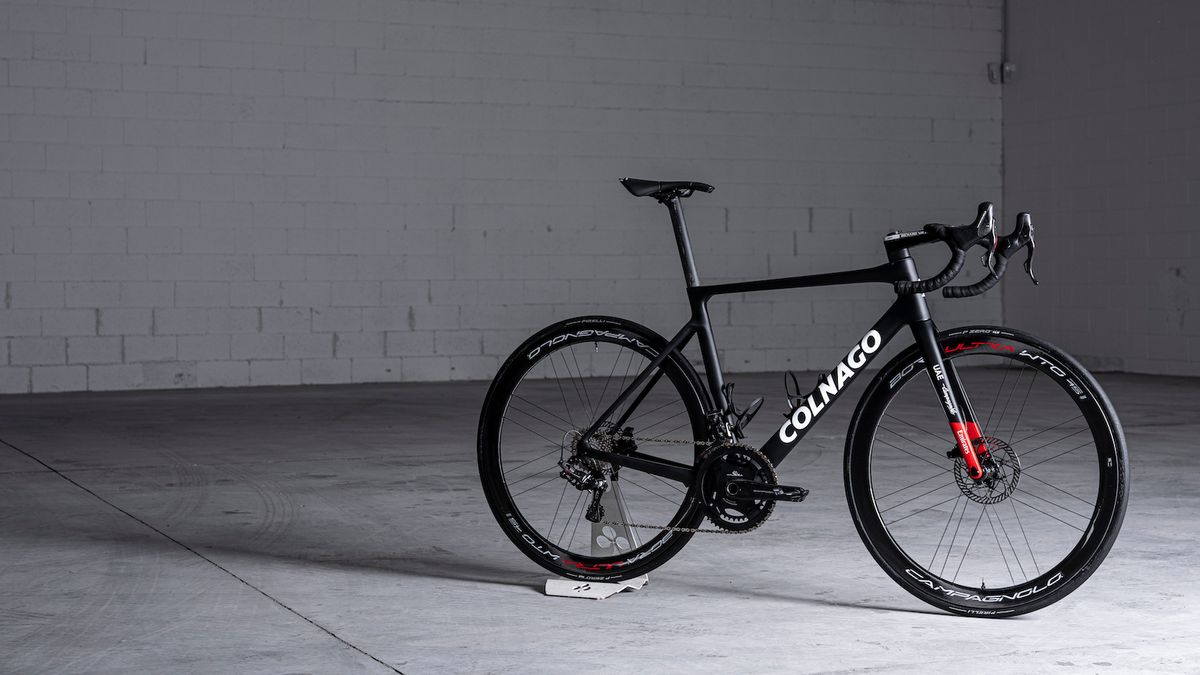 A black Colnago Prototipo in a warehouse