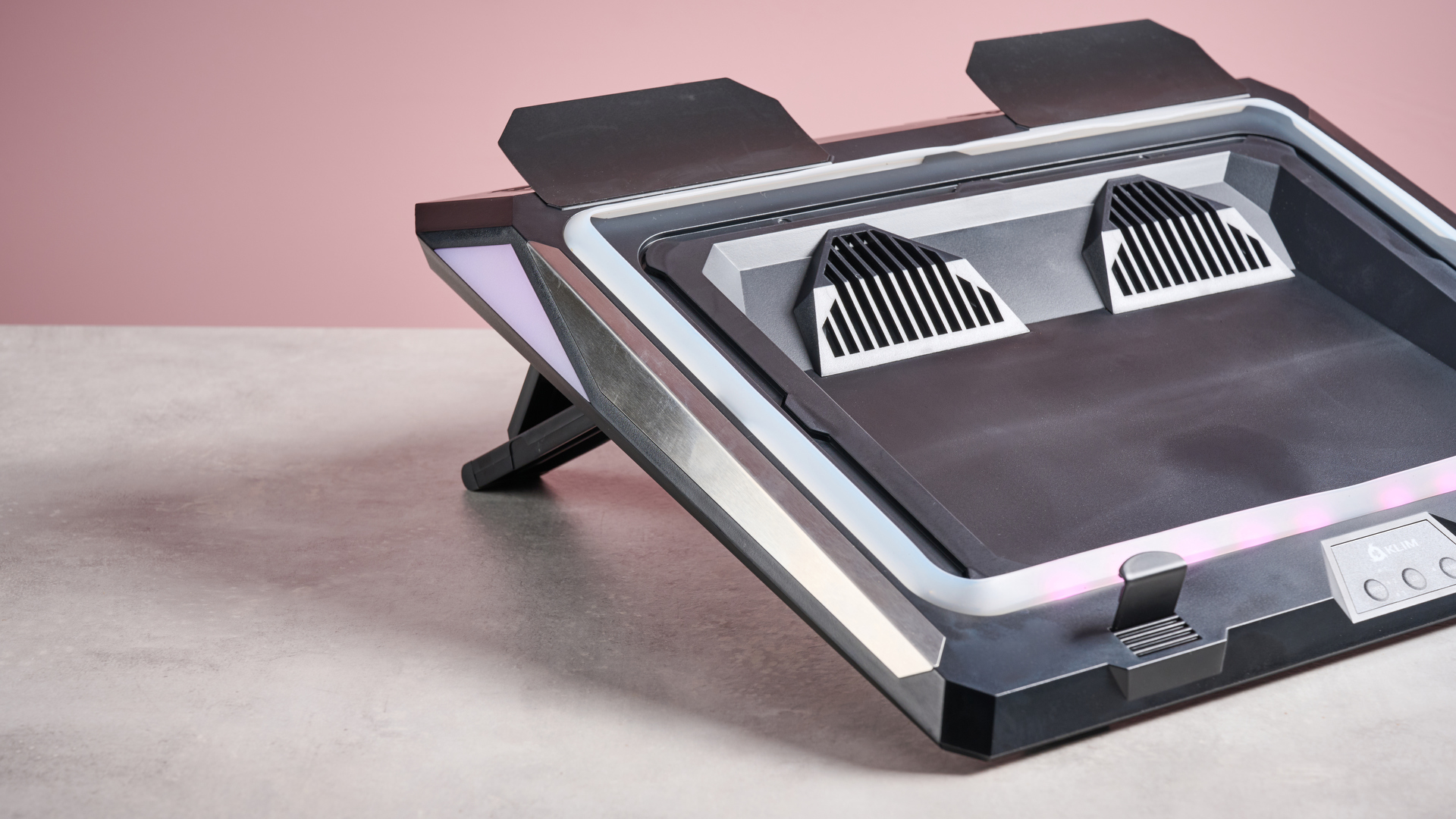 A 3/4s view of the Klim Mistral, showing its built-in fans, side-lighting and rear feet.