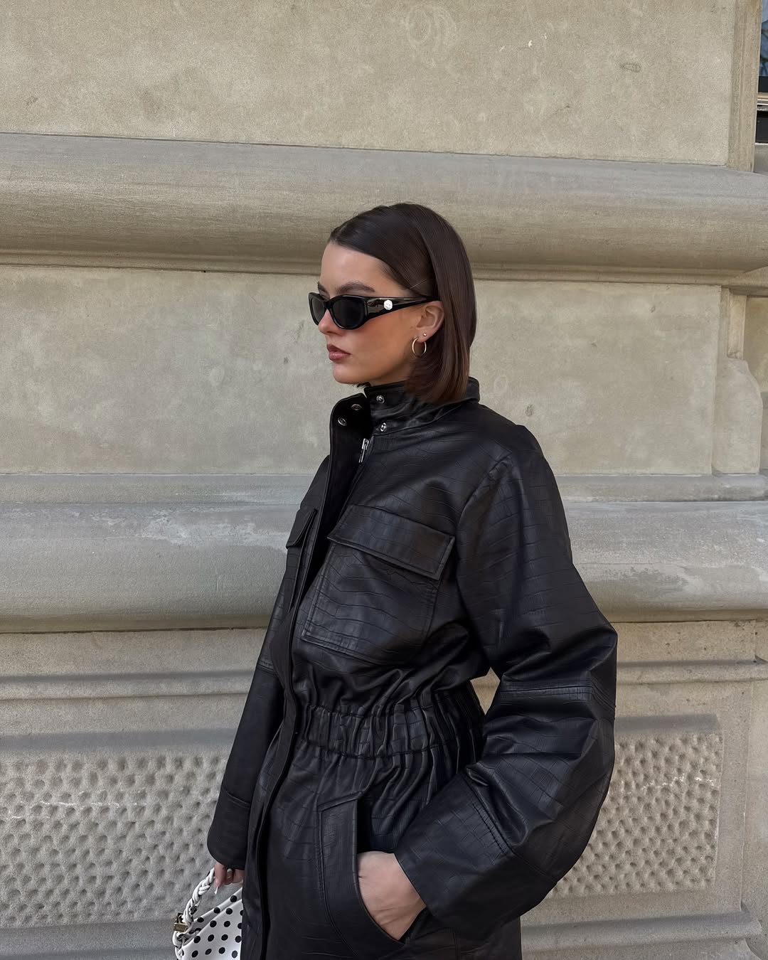 Mary L. Jean wearing a black leather jacket and coiffed bob