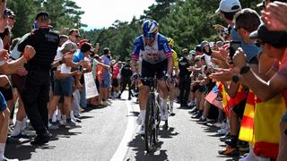 Primoz Roglic of Slovenia and Team Red Bull competes climbing to the Aramon Valdelinares (1,965m) while fans cheer during the La Vuelta a Espana 2026.