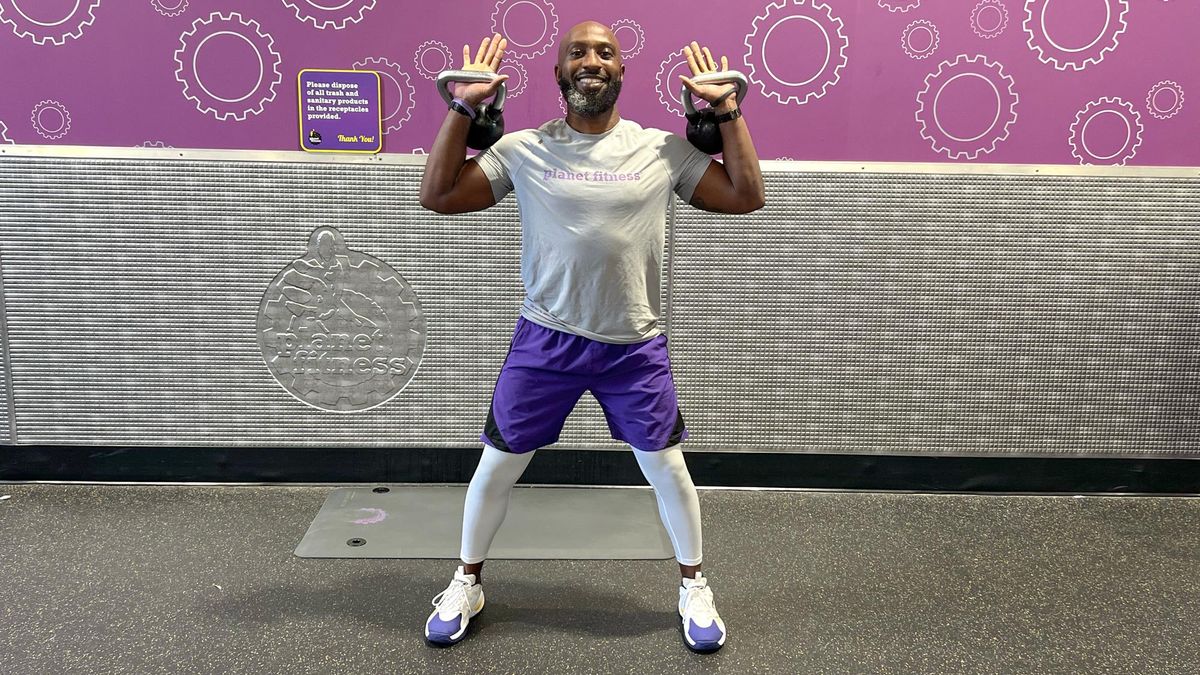 Teddy Savage doing a kettlebell clean to overhead press