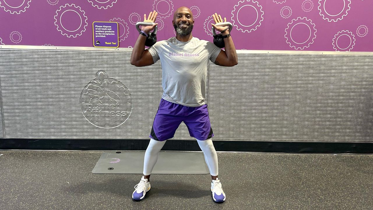 Teddy Savage doing a kettlebell clean to overhead press