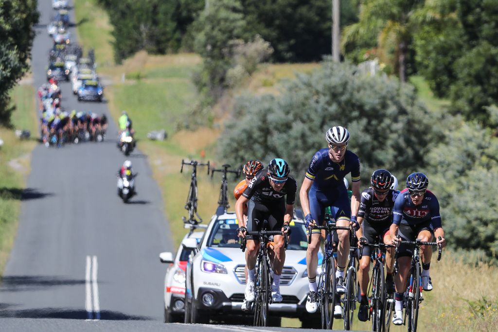 The breakaway about to get of sight from the peloton