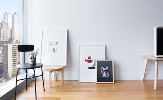 White room with various art prints