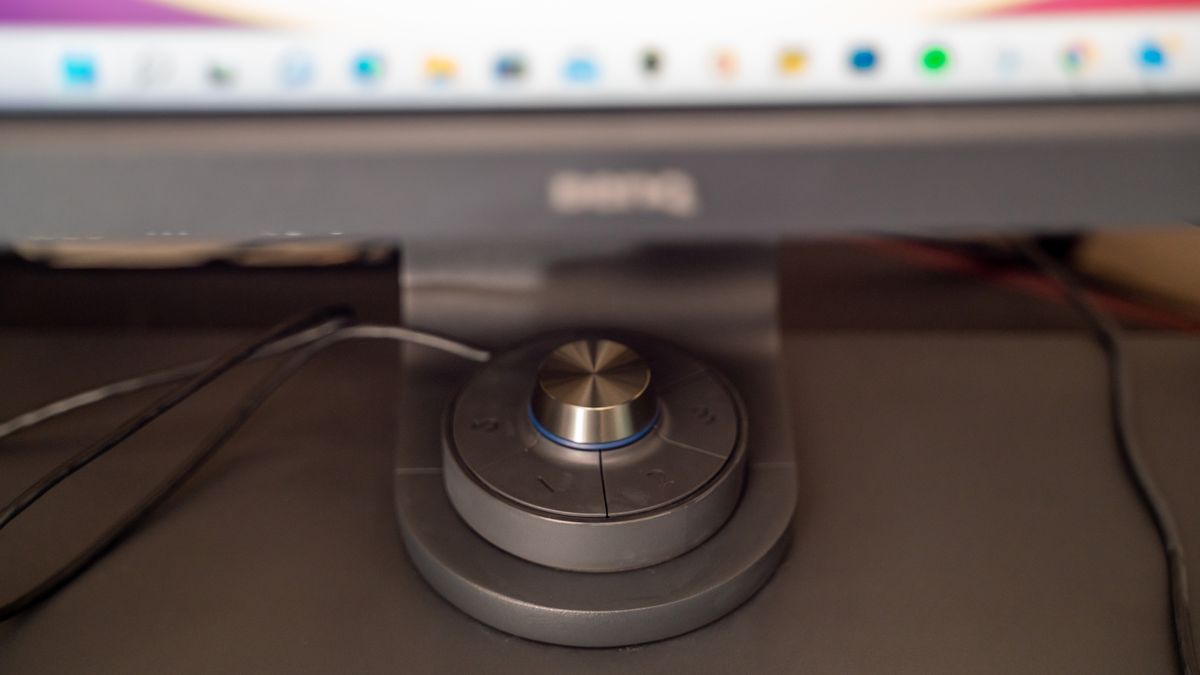 A close up image of the BenQ SW321C hotkey puck