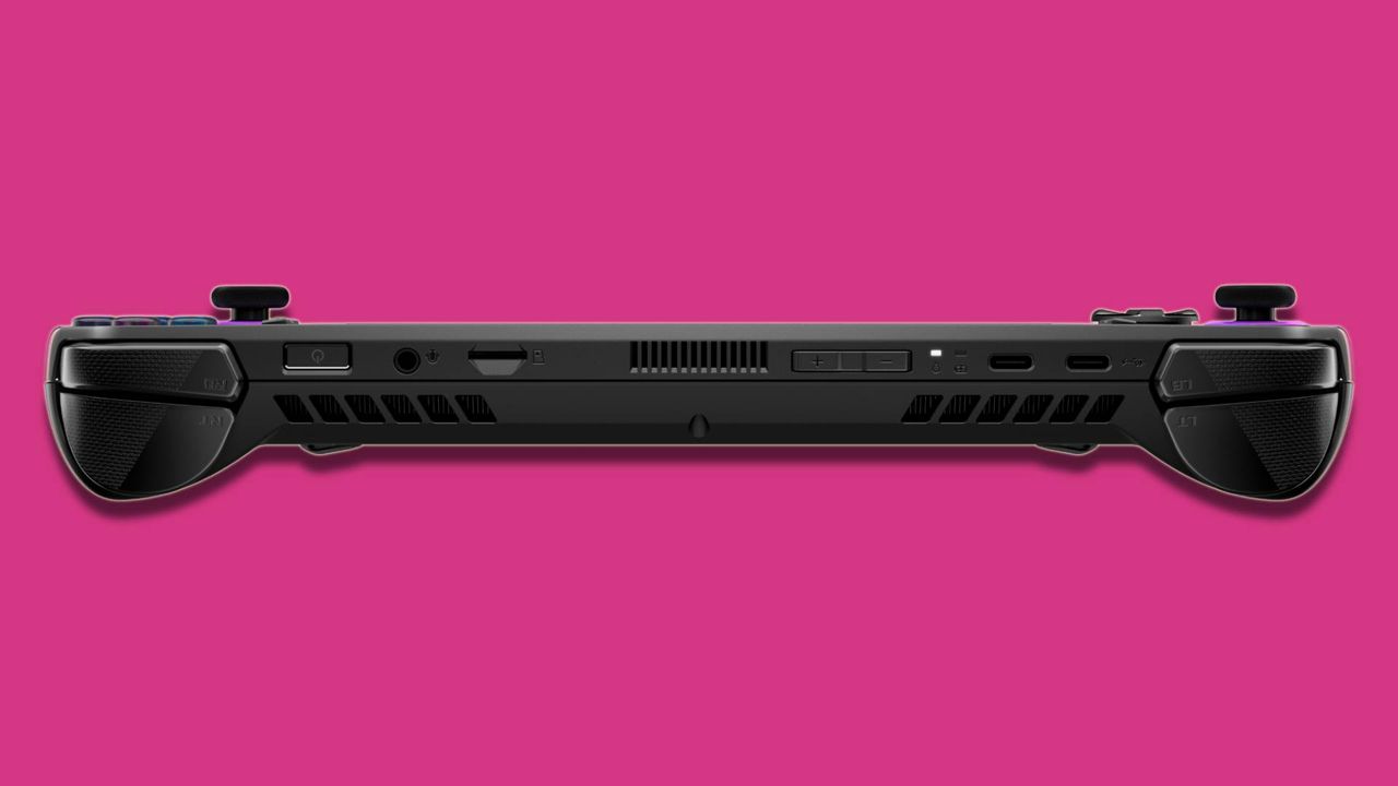 black PC gaming handheld against pink background