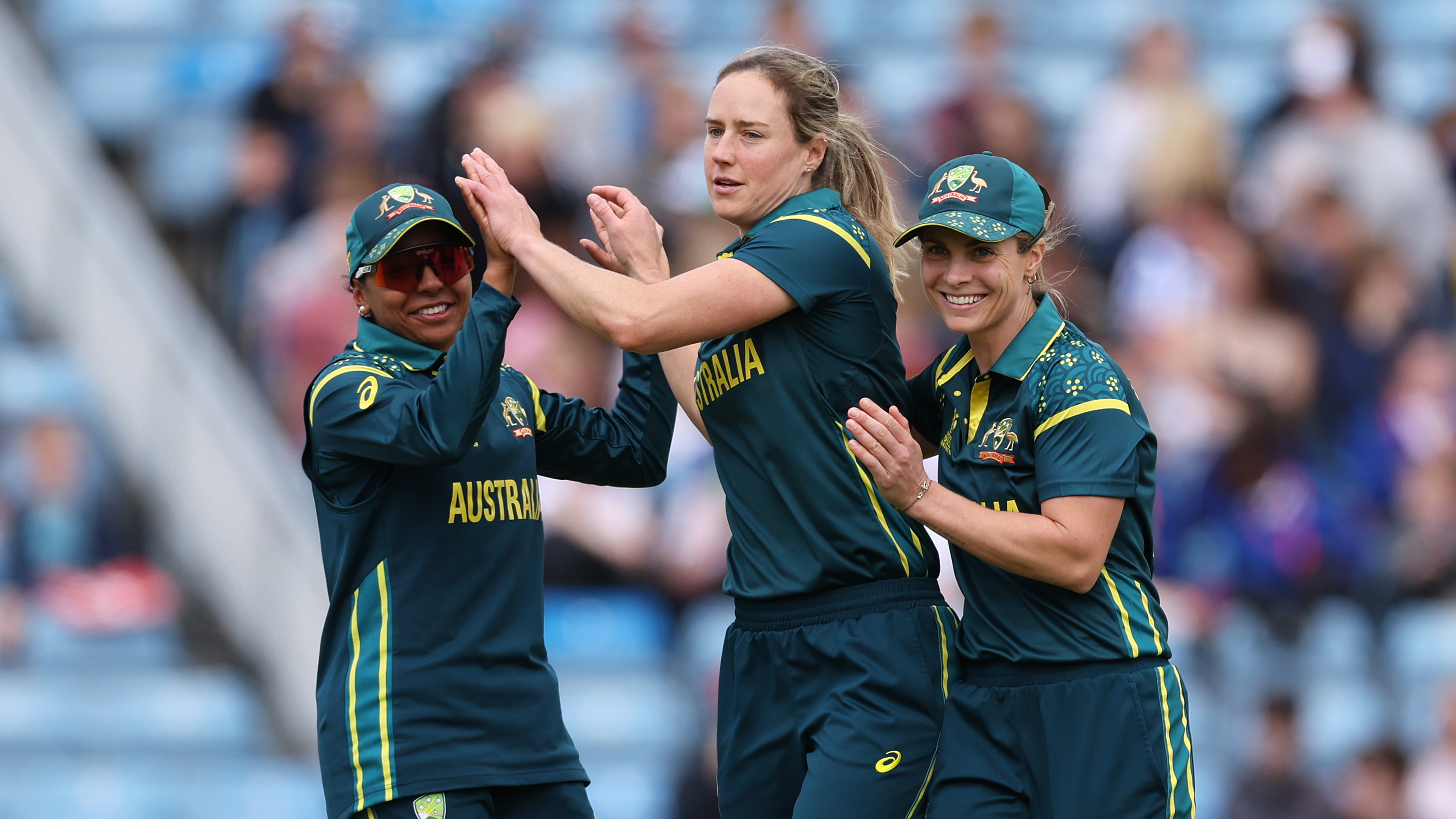 Ellyse Perry of Australia celebrates with teammates Sophie Molineux and Alana King