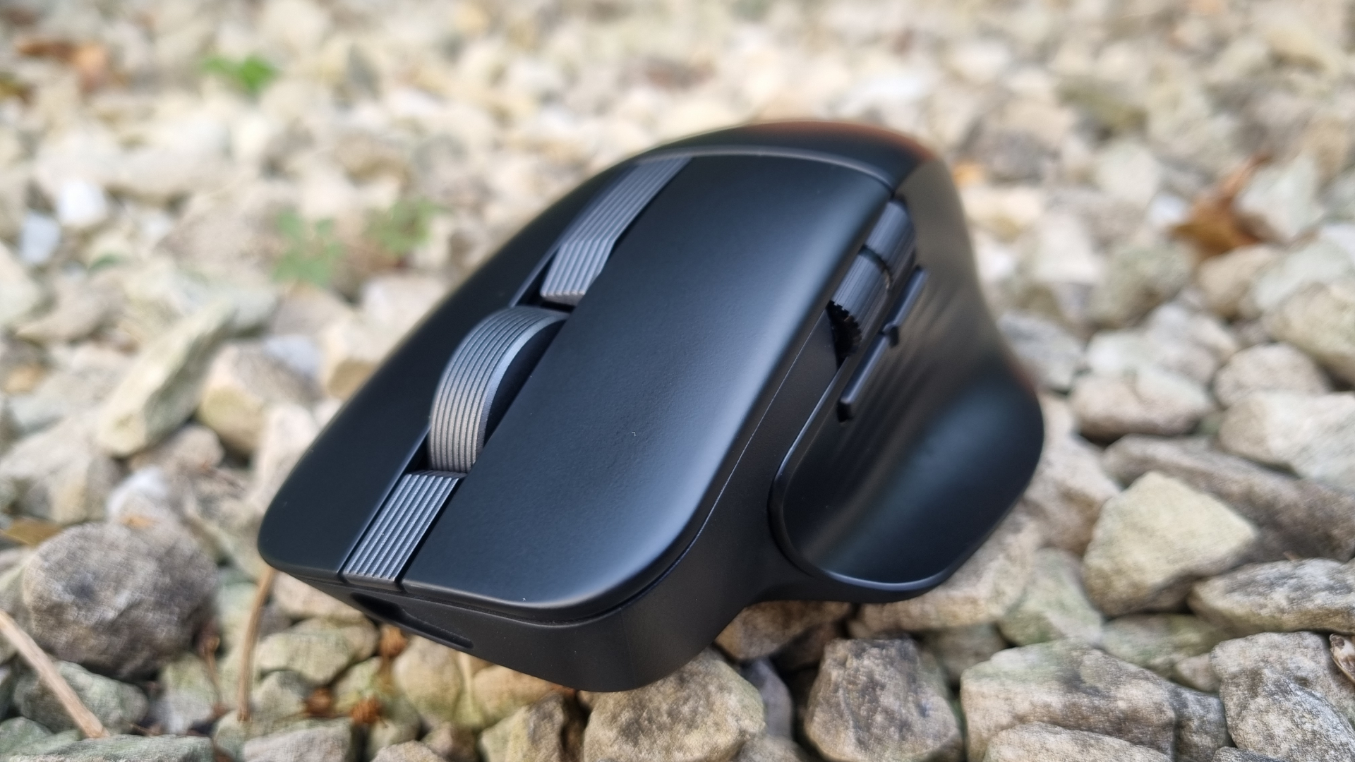 An Asus ProArt MD301 looking pretty at a 3/4 angle, on top of white gravel