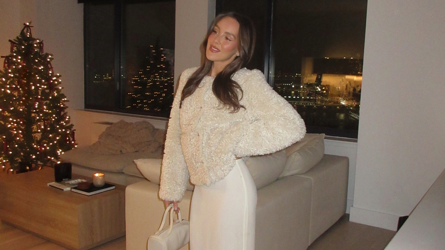 Emma Leger in a white fur coat and maxi skirt