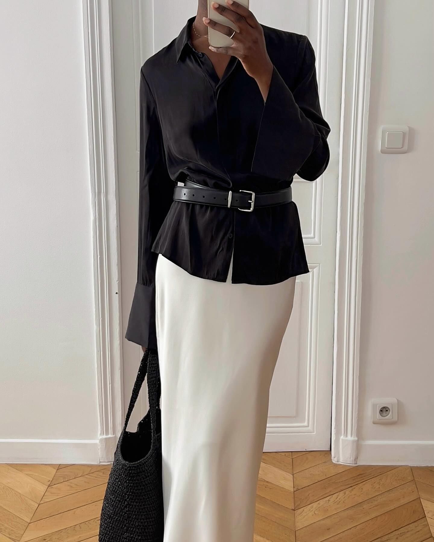 An image of @sylviemus_ wearing a white satin skirt.