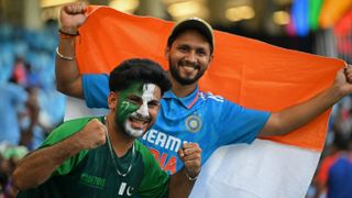 Pakistan and India fans cheer before the start of the Asia Cup 2025 Twenty20 international cricket match between India and Pakistan at the Dubai International Stadium in Dubai on September 14, 2025.