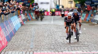 Team Qhubeka Assos rider Belgiums Victor Campenaerts L sprints next to Caja Rurals Jon Aberasturi to win the 15th stage of the Giro dItalia 2021 cycling race 147km between Grado and Gorizia on May 23 2021 Photo by Luca Bettini AFP Photo by LUCA BETTINIAFP via Getty Images