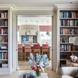 snug area with book shelf and flower vase