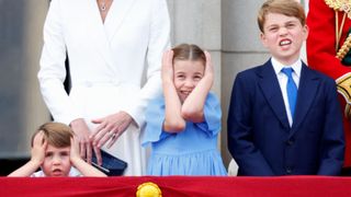 Prince Louis of Cambridge, Princess Charlotte of Cambridge and Prince George of Cambridge watch a flypast from the balcony of Buckingham Palace during Trooping the Colour on June 2, 2022 in London, England