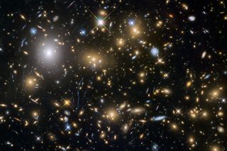 An image of many galaxies and stars in outer space