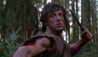 First Blood John Rambo holds his knife up threateningly