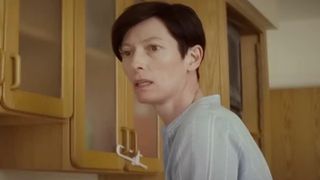 Tilda Swinton looking off to the side in We Need to Talk About Kevin