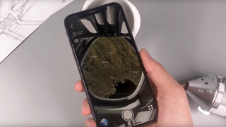 Phone being held over the NASA AR mug