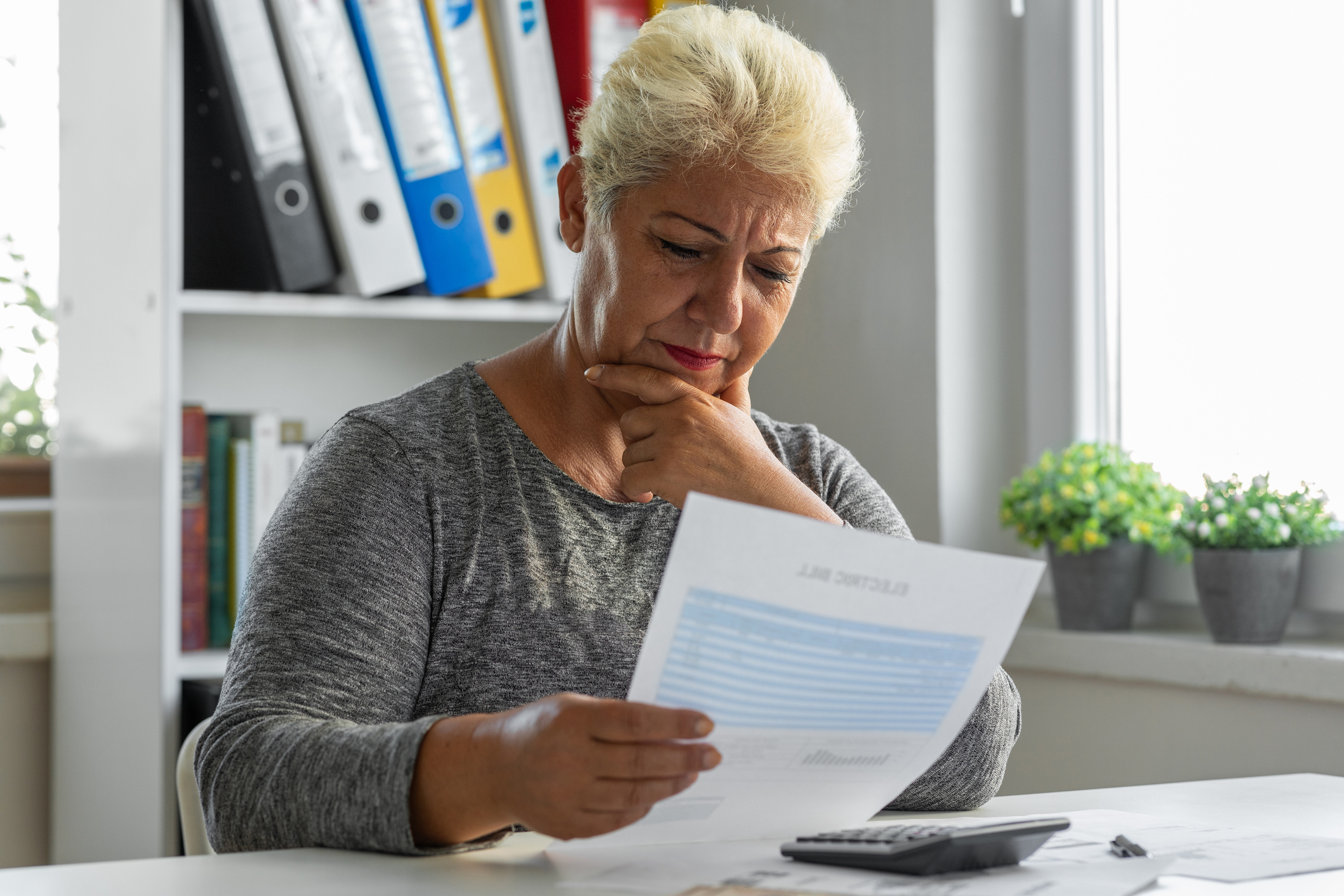 Woman having problems with her bills at home