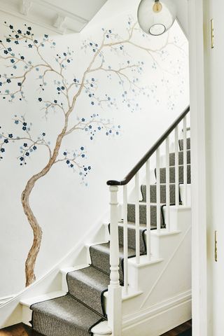 staircase with botanical wallpaper