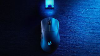 The Elecom VM800 wireless gaming mouse lit up in blue, with its glowing blue dongle shown above