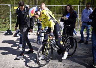 Wout van Aert stopped along the walking path in the Arenberg forest after puncturing