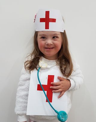 Young girl in nurses outfit