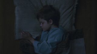 Young Luke Skywalker sleeping in bed in Obi-Wan Kenobi series