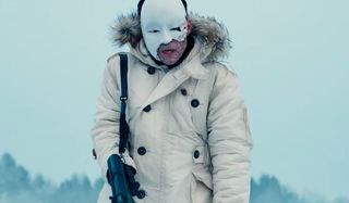 Safin wearing his broken mask, as he hunts, in No Time To Die.