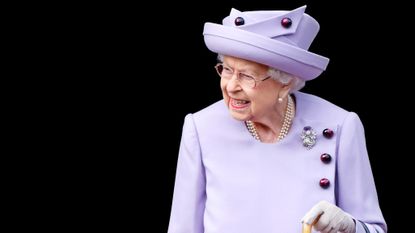 Queen Elizabeth in a lavender outfit