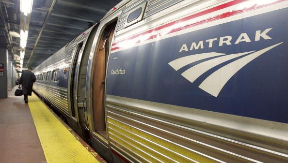 http://www.gettyimages.com/detail/news-photo/man-walks-to-board-an-amtrak-train-in-penn-station-november-news-photo/56196912