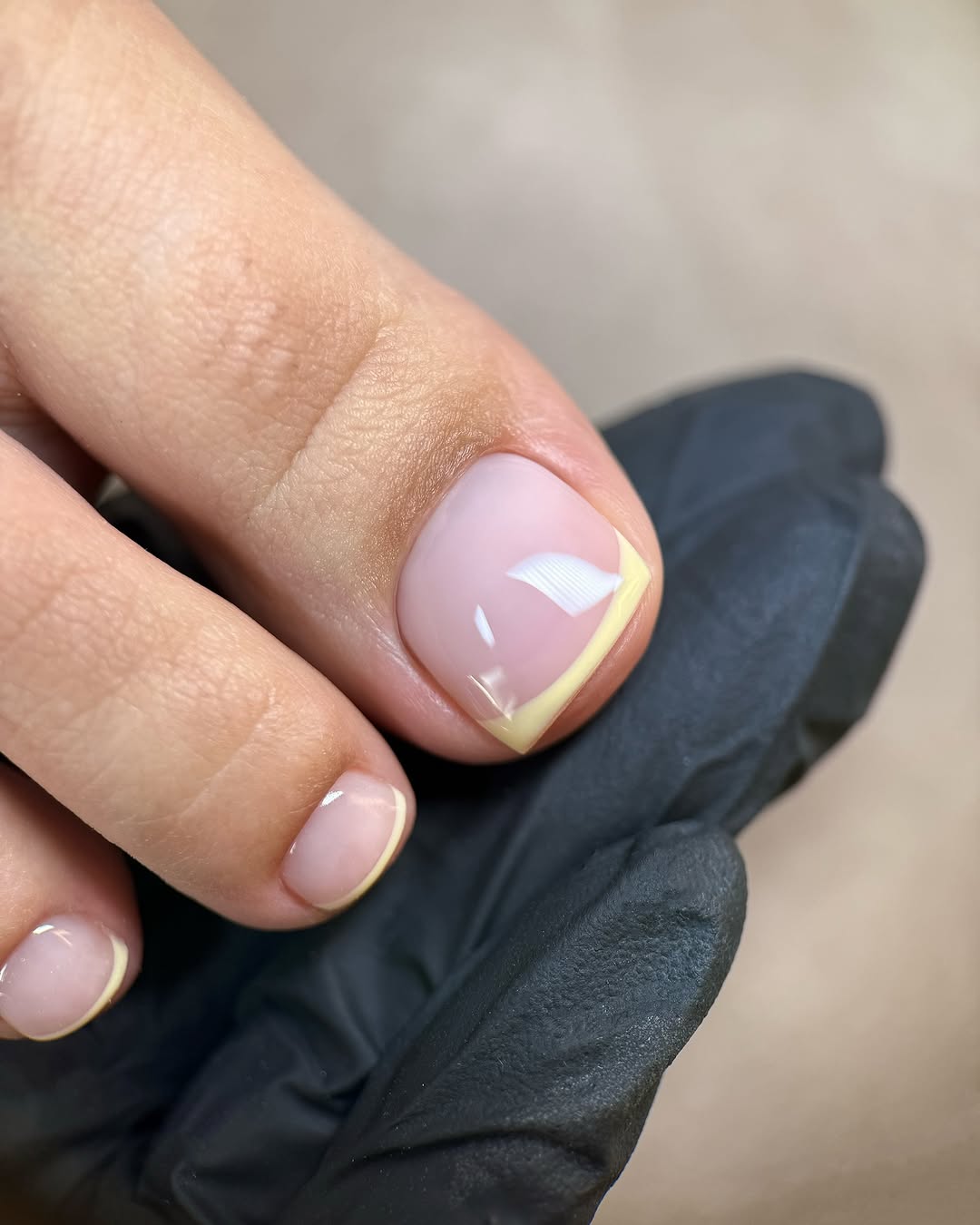 french tip pedicure with a butter yellow accent