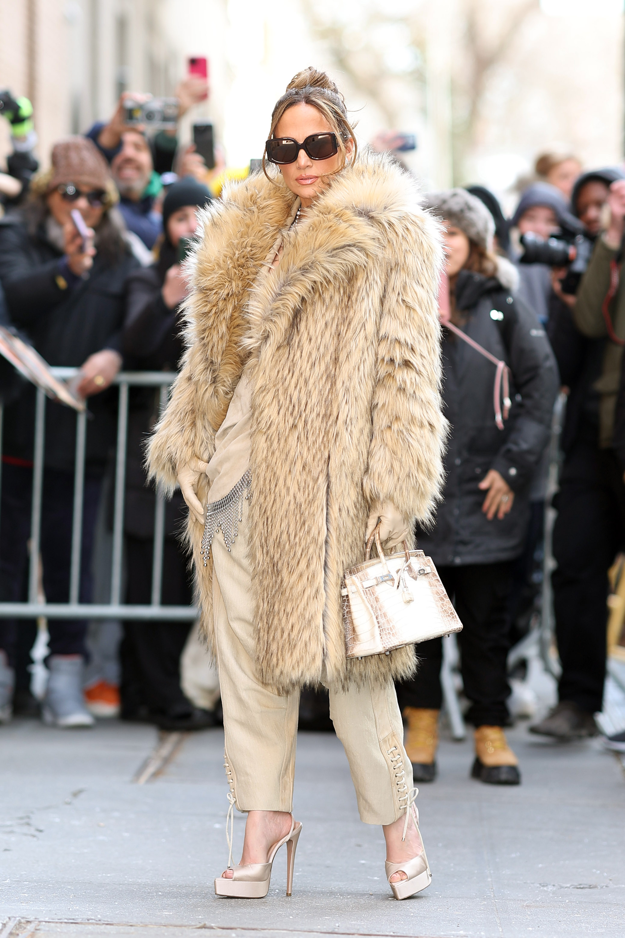 Jennifer Lopez carried a $98,000 white crocodile Hermès Birkin in Feb. 2024.