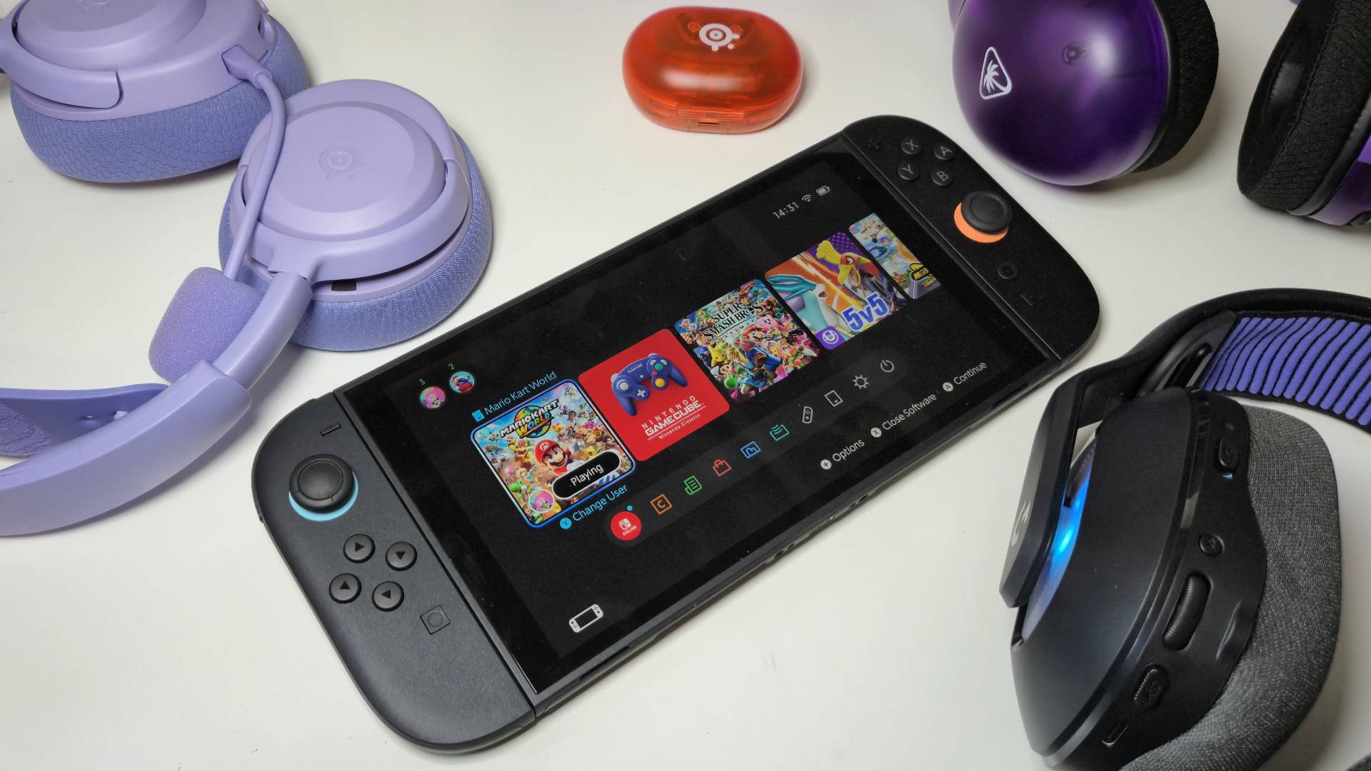 Photo by Rosalie Newcombe of the Nintendo Switch 2 with a bunch of gaming headsets sitting around it.