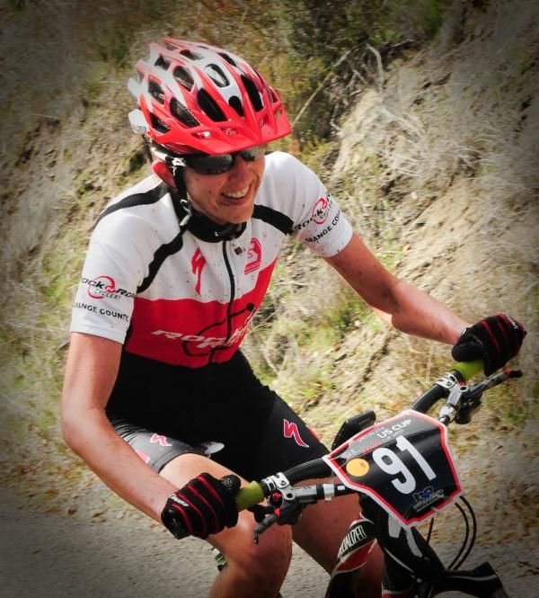 Alison Mann (Rock and Road) in second place on a long climb