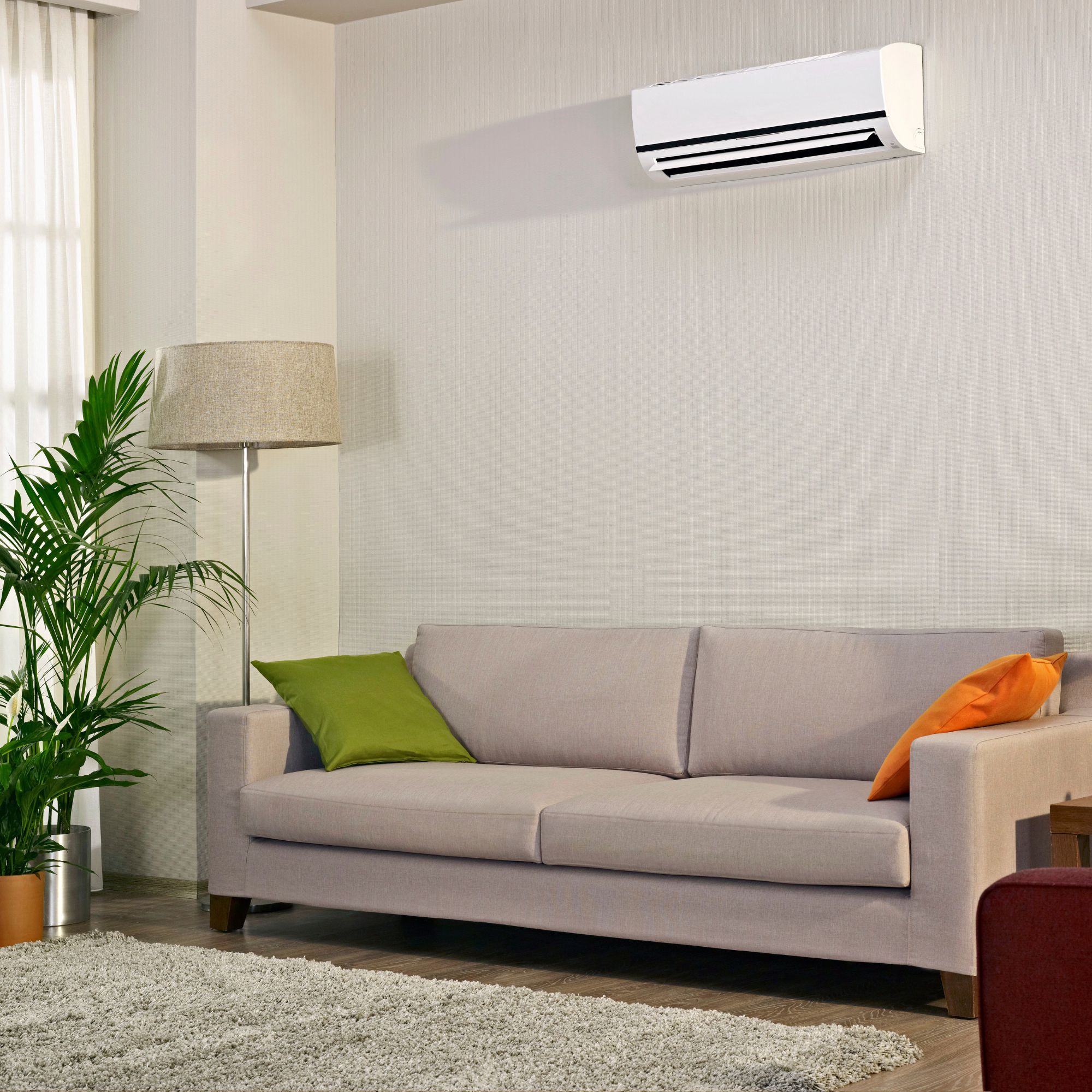 Indoor air conditioning unit installed on the wall in a living room