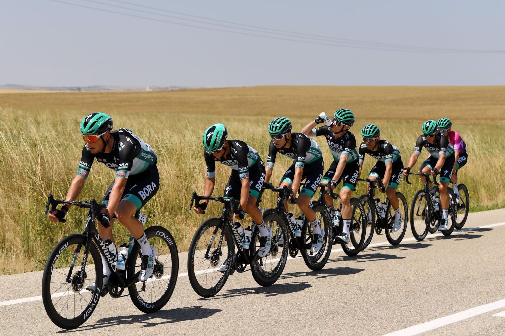 VILLADIEGO SPAIN JULY 29 Lukas Pstlberger of Austria and Team BoraHansgrohe Matteo Fabbro of Italy and Team BoraHansgrohe Lennard Kmna of Germany and Team BoraHansgrohe Jay Mc Carthy of Australia and Team BoraHansgrohe Rafal Majka of Poland and Team BoraHansgrohe Felix Grossschartner of Austria and Team BoraHansgrohe Purple Leader Jersey Peloton Landscape during the 42nd Vuelta a Burgos 2020 Stage 2 a 168km stage from Castrojeriz to Villadiego VueltaBurgos on July 29 2020 in Villadiego Spain Photo by David RamosGetty Images