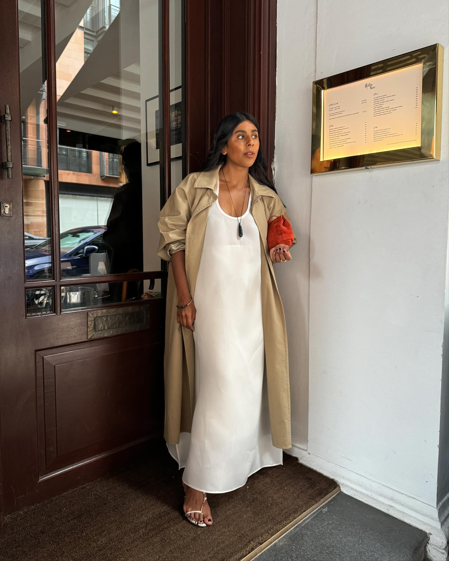 An image of @monikh wearing one of the best clutch bags.