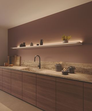 Novy Designer Lighting 2.0 Shelf 275 in Mineral White on wall in kitchen with modern wooden fronted cabinets, grey and white marble effect worktop