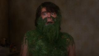 Stephen King as Jordy Verrill with face, chest and shoulders covered with plants in Creepshow