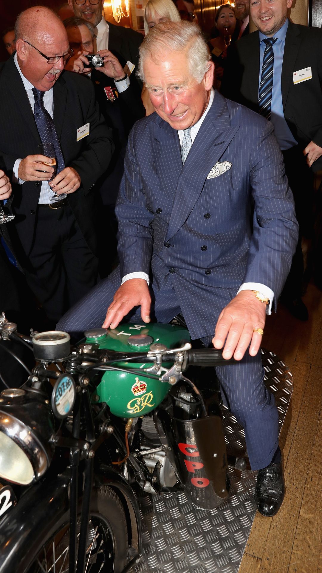 King Charles on a Royal Mail motorbike.