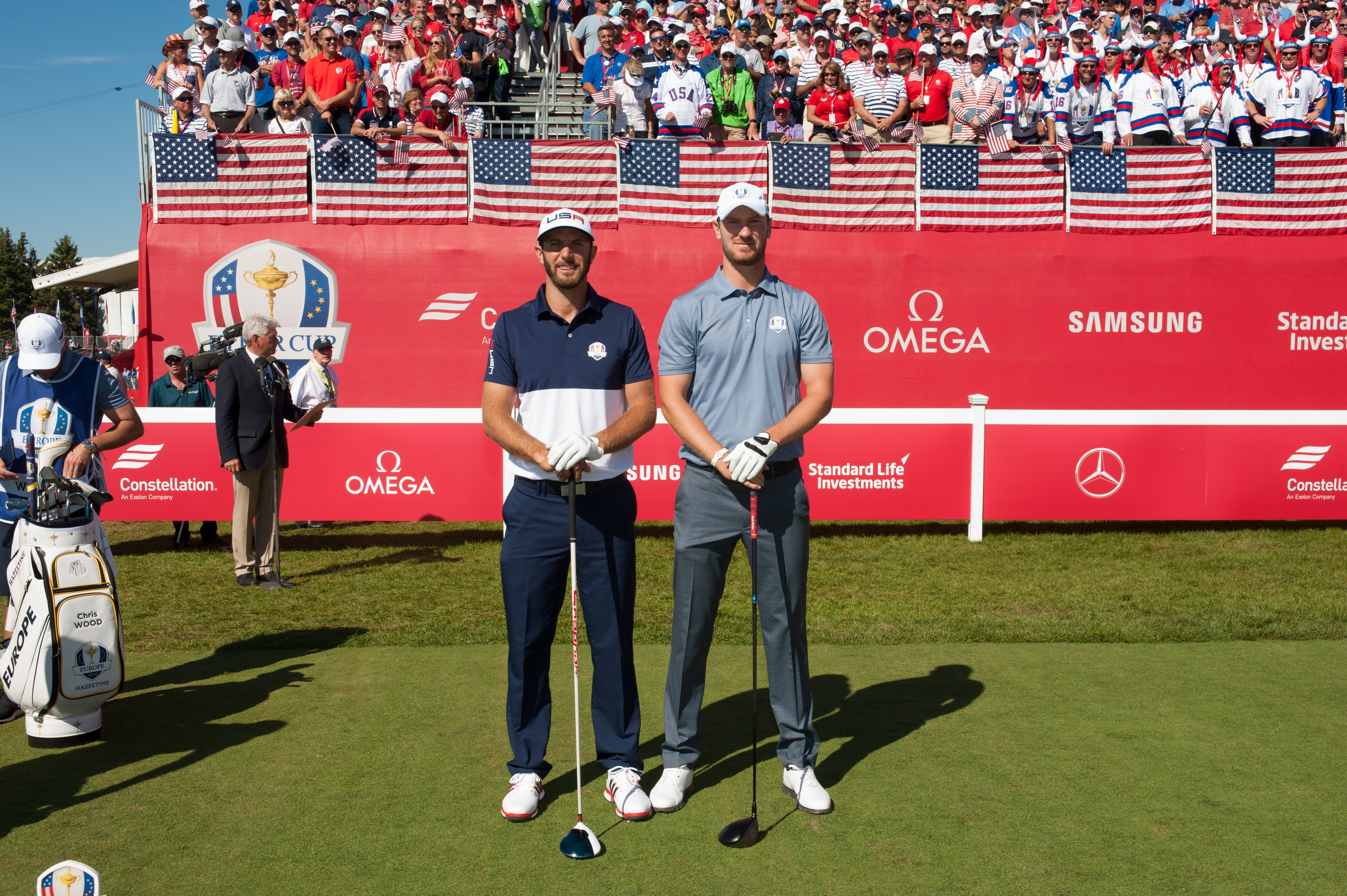 Dustin Johnson (left) and Chris Wood stand next to each other before teeing off in their Sunday Singles contest at the 2016 Ryder Cup