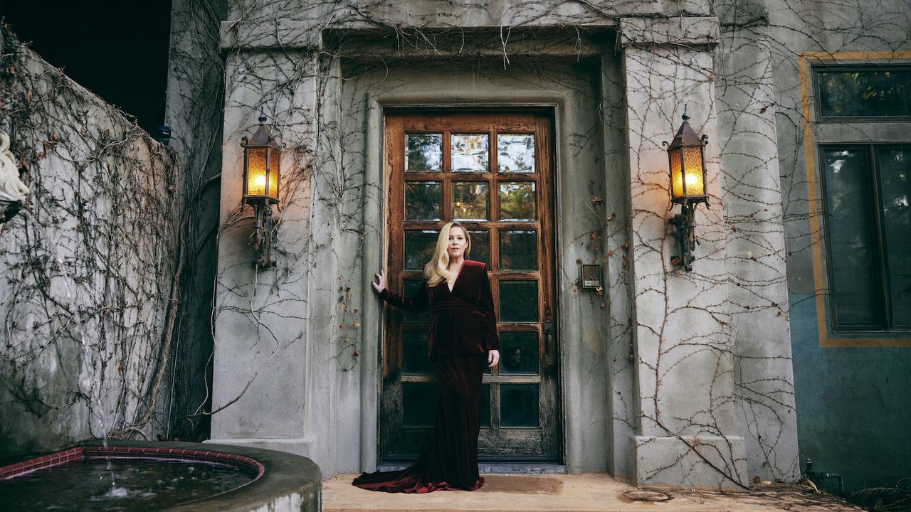 Christina Applegate in her gothic garden in a red velvet Christian Sirano dress ahead of The Emmys in 2024