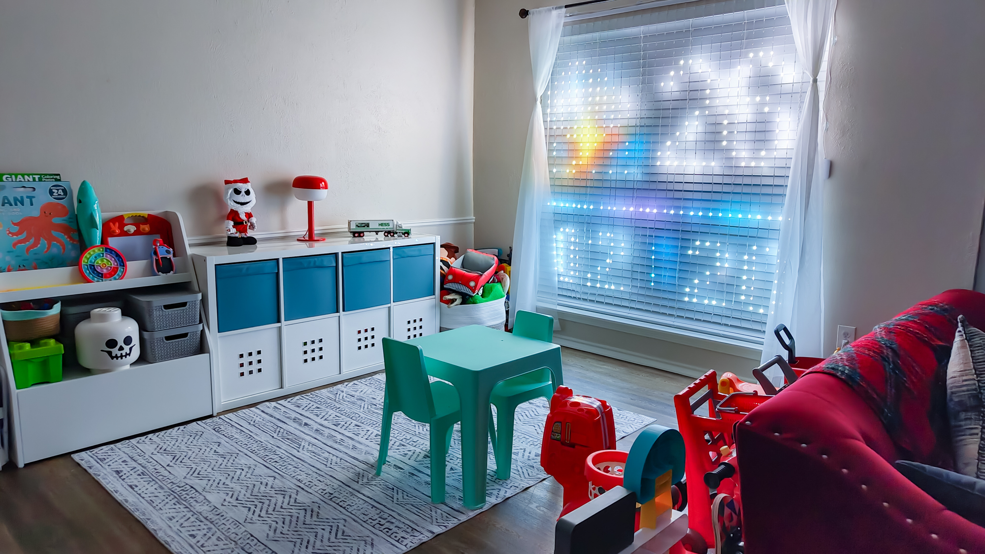 A wide shot of a child&#039;s playroom with the Govee Curtain Lights Pro installed in a window