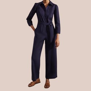 woman wearing navy jumpsuit 