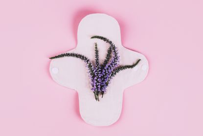 Vaginal infection types: An abstract shot of a period pad with a flower on top