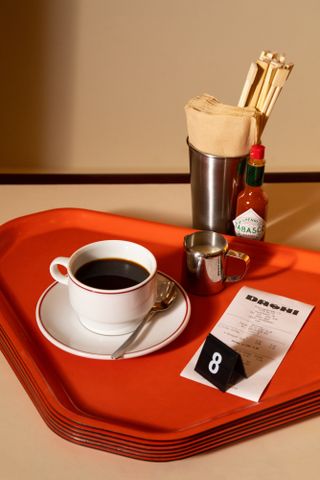 Coffee and the number 8 on a tray