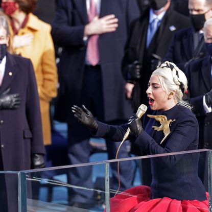 washington, dc january 20 lady gaga sings the national anthem at the inauguration of us president elect joe biden on the west front of the us capitol on january 20, 2021 in washington, dc during todays inauguration ceremony joe biden becomes the 46th president of the united states photo by alex wonggetty images