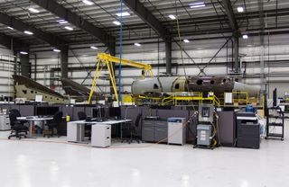 Virgin Galactic's second SpaceShipTwo suborbital spacecraft is seen under construction. Virgin Galactic plans to use SpaceShipTwo to launch two pilots and six passengers on suborbital spaceflights. Tickets are available for $250,000 per seat.